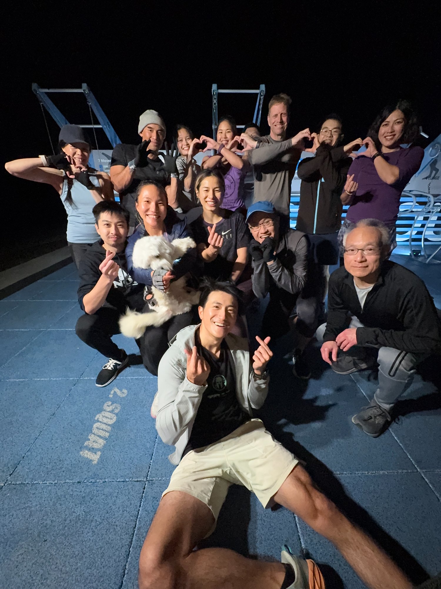 Fit Crew making heart shapes after evening workout