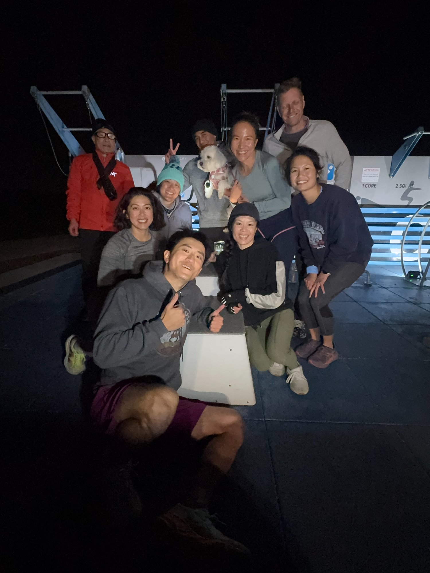 Fit Crew group selfie at night